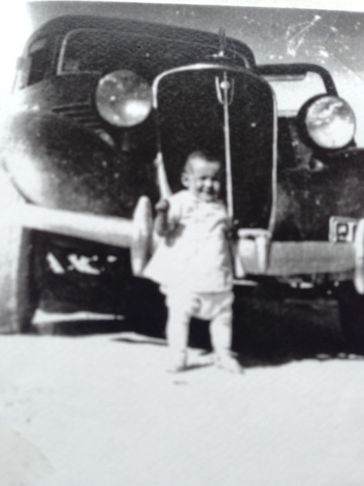 Becky baby in front of car