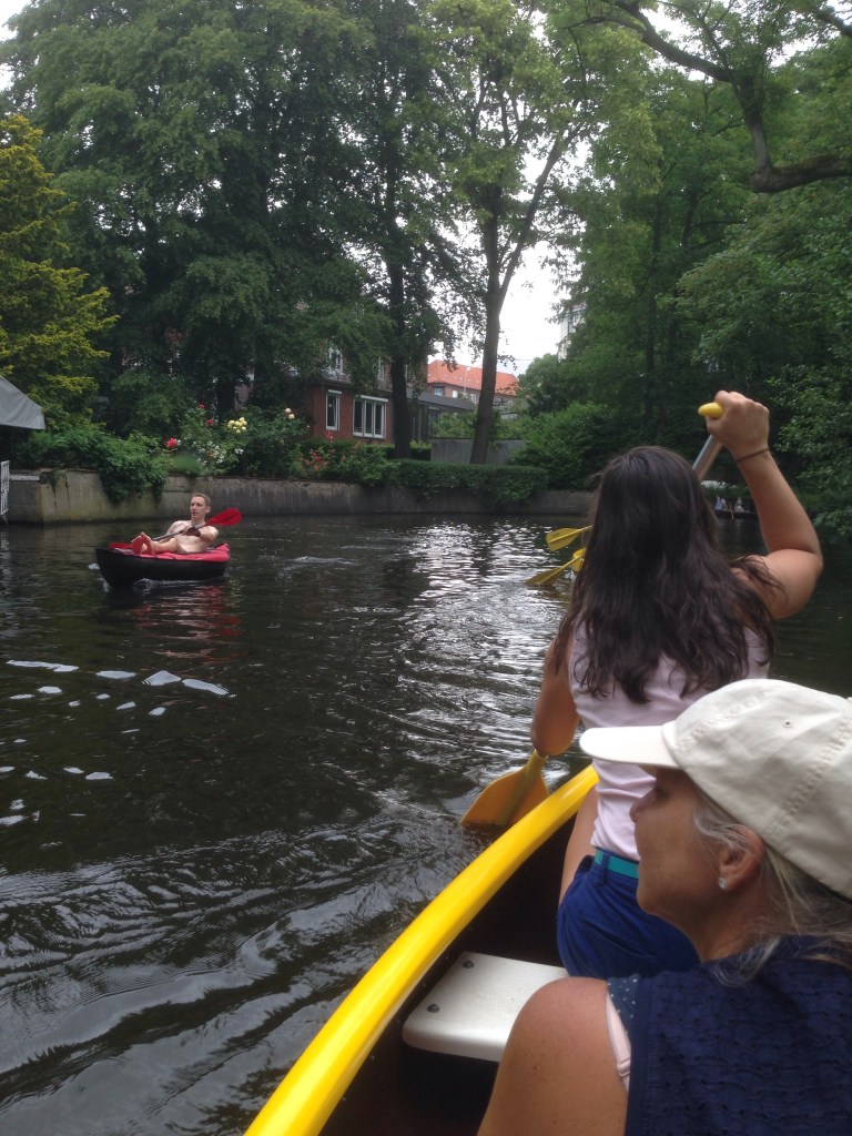 Canoeing under the treed canopy of the Alster River